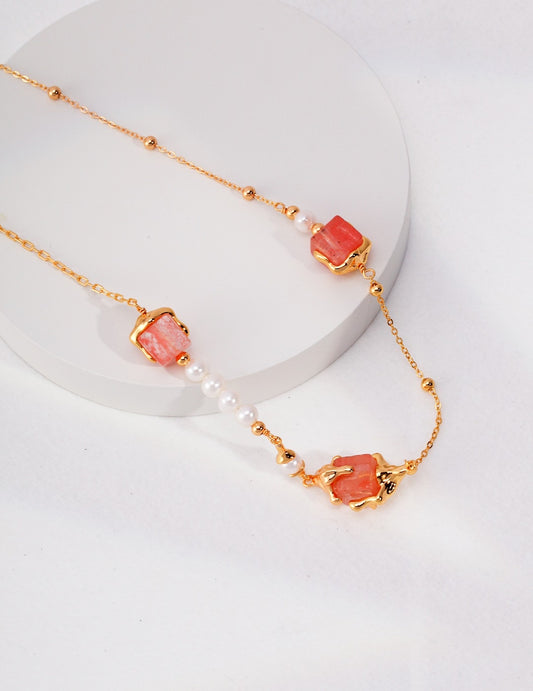 Macro detail of 8mm cubic crystal and 5mm pearl on 925 silver pendant chain